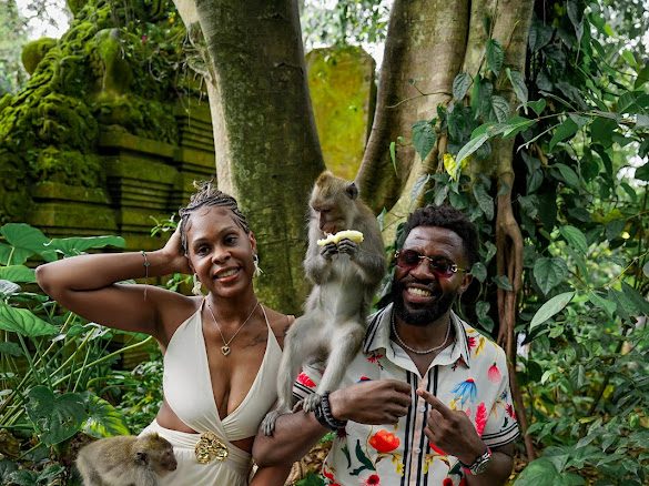 The couple with a monkey in the Sacred Monkey Forest